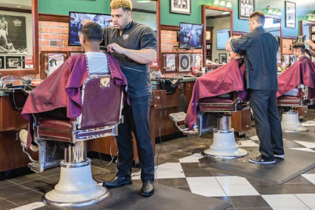 V's Barbershop barbers at work